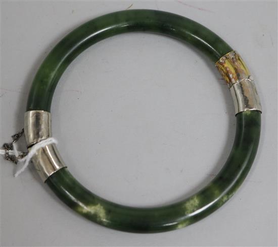 A spinach jade hinged bangle.